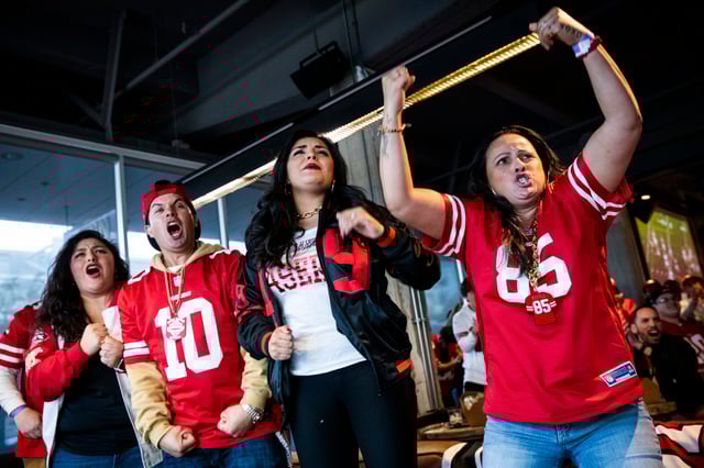 Fans react as they watch the San Francisco 49ers play the Kansas City Chiefs during a Super Bowl LIV watch party on Feb. 2, 2020.