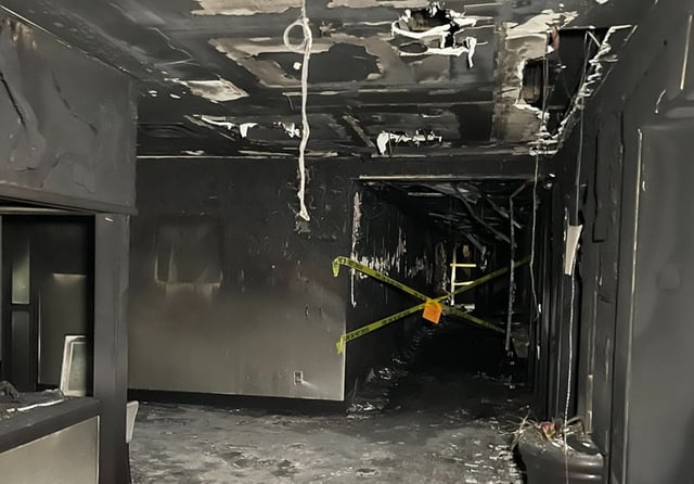 Burnt out hallway in office building housing conservative groups (@KathrynHindy/Twitter)