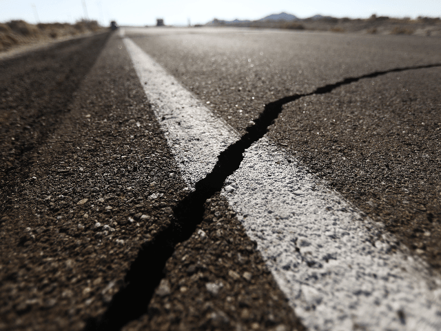 A crack stretches across the road after a 6.4 magnitude earthquake struck the area on July 4, 2019 near Ridgecrest, California. The earthquake was the largest to strike Southern California in 20 years with the epicenter located in a remote area of the Mojave Desert. The temblor was felt by residents across much of Southern California. (Photo by Mario Tama/Getty Images)