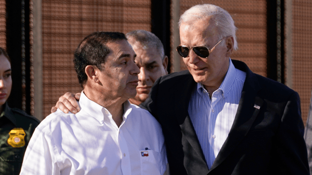 President Joe Biden talks with Rep. Henry Cuellar, D-Texas, as they walk along a stretch of the U.S.-Mexico border in El Paso Texas, Sunday, Jan. 8, 2023. (AP Photo/Andrew Harnik)