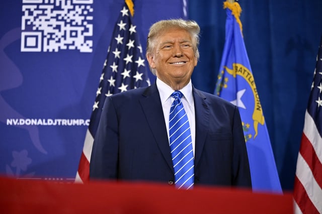 Former U.S. President Donald Trump stands