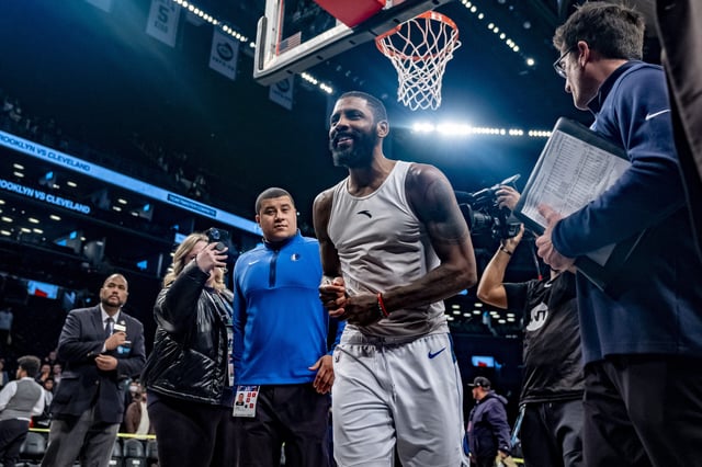 Kyrie Irving leaves the court at Barclays Center with a smile and a victory for the Dallas Mavericks over his former Nets teammates. AP Photo by Peter K. Afriyie