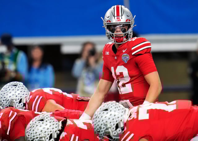 Dec 29, 2023; Arlington, Texas, USA; Ohio State Buckeyes quarterback Lincoln Kienholz (12) replaced injured starting quarterback Devin Brown (33) in the second quarter against Missouri Tigers during the Goodyear Cotton Bowl Classic at AT&T Stadium.