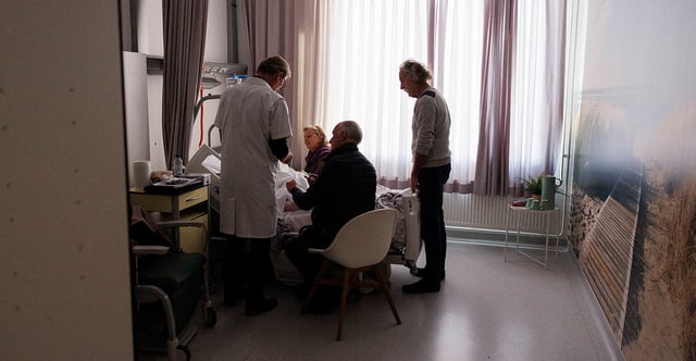The Virginia Senate passed a bill permitting assisted suicide, which critics say "embraces a profit-driven industry that seeks to exploit patient suffering." Pictured: A doctor prepares a dying person for their assisted suicide in Belgium on Feb. 1. (Photo: SIMON WOHLFAHRT, AFP/Getty Images)