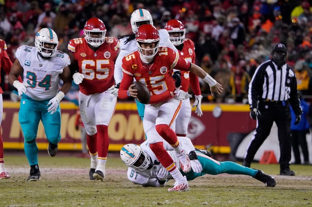 Kansas City Chiefs quarterback Patrick Mahomes (15) runs against Miami Dolphins defensive end Emmanuel Ogbah (91) during an NFL wild-card playoff football game Saturday, Jan. 13, 2024 in Kansas City, Mo.