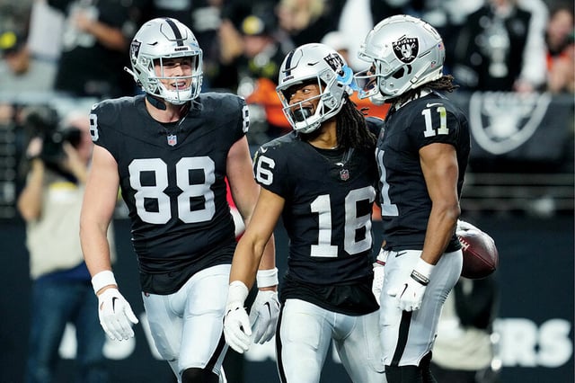 Las Vegas Raiders players Zach Gentry (88), Jakobi Meyers (16), and Tre Tucker (11) celebrate during a game against the Denver Broncos, Jan. 7, 2024.