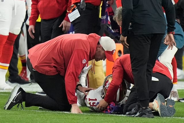 San Francisco 49ers wide receiver Deebo Samuel (19) is helped after an injury against the Kansas City Chiefs during the second half of Super Bowl 58.