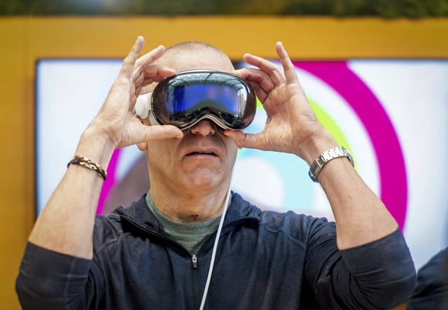 Scott Joachim tries out an Apple Vision Pro headset during the first day of sales at an Apple store in Palo Alto, Calif., on Friday, Feb. 2, 2024. 