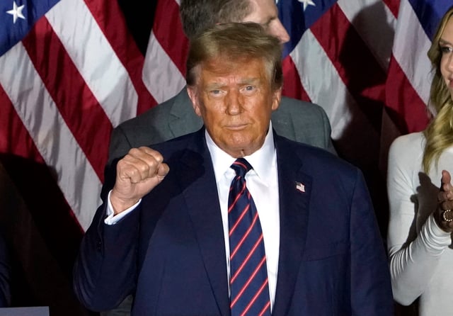 Former President Donald Trump gestures during an election night party in Nashua, N.H., on Jan. 23, 2024.