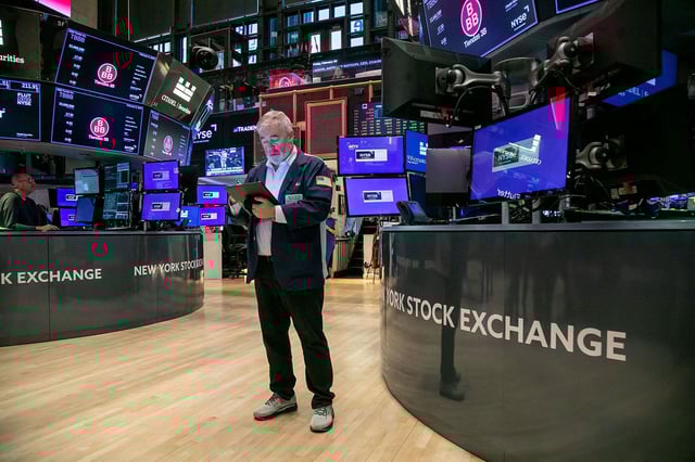 A trader works on the floor of the New York Stock Exchange (NYSE) in New York, US, on Friday, Feb. 9, 2024. Mexican discount retailer BBB Foods Inc. priced its initial public offering at the top of a marketed range to raise about $589 million, adding momentum to a rebound in US listings. Photographer: Michael Nagle/Bloomberg via Getty Images