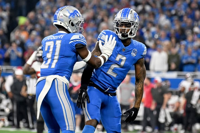 Lions safety Kerby Joseph (31) and safety C.J. Gardner-Johnson (2) react after a play against the Buccaneers during the first quarter of their NFC divisional round game at Ford Field in Detroit on Jan. 21, 2024.