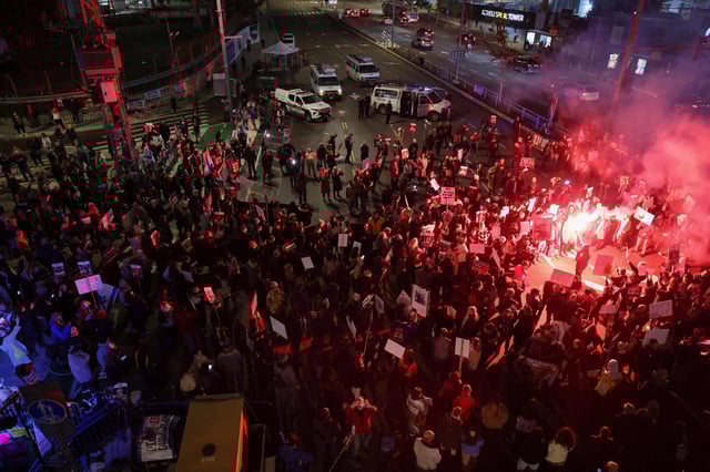 Relatives and supporters of Israeli hostages held in Gaza since the Oct. 7 attacks by Palestinian Hamas militants light flares and block a road in Tel Aviv on Thursday during a demonstration calling for their release. Photo: AFP