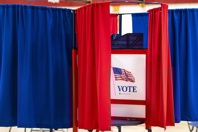 A voting booth at a polling station inside Plymouth Elementary School in Plymouth, New Hampshire, US, on Tuesday, Jan. 23, 2024.
