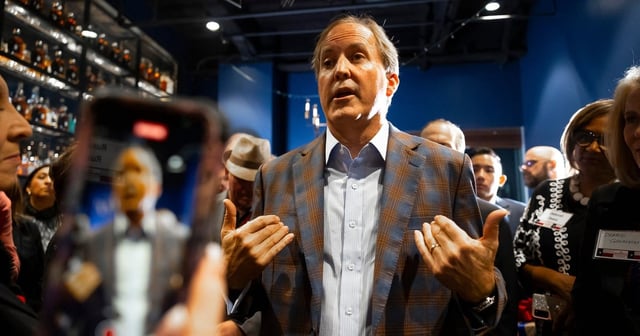 Texas Attorney General Ken Paxton speaks to attendees during a reception for Jared Woodfill at the Federal American Grill on Monday, Feb. 5, 2024, in Houston.