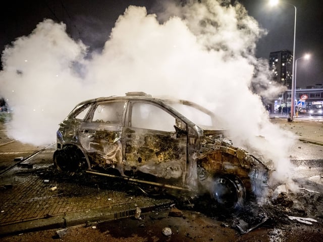 A police car burns at the Opera hall center following clashes between two groups of Eritreans during riots after a meeting in the conference center in The Hague on February 17, 2024. (Photo by Robin Utrecht / ANP / AFP) / Netherlands OUT (Photo by ROBIN UTRECHT/ANP/AFP via Getty Images)