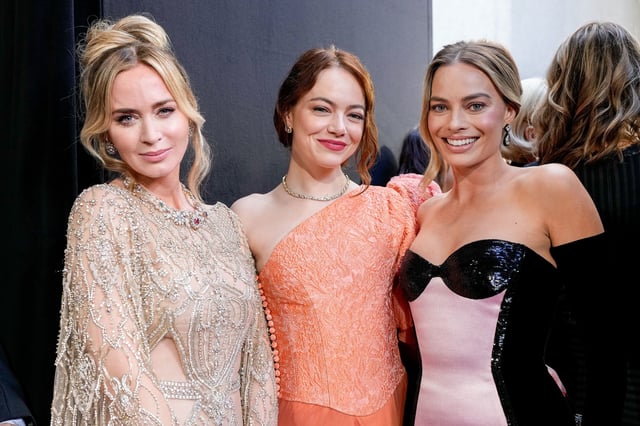 LONDON, ENGLAND - FEBRUARY 18: (L to R) Emily Blunt, Emma Stone and Margot Robbie attend the EE BAFTA Film Awards 2024 at The Royal Festival Hall on February 18, 2024 in London, England. (Photo by Scott Garfitt/BAFTA via Getty Images)