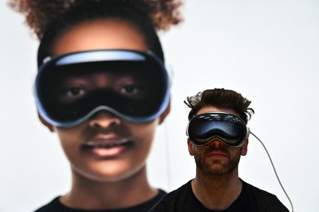 A person uses the Apple Vision Pro headset during the product launch at the Apple Store in New York City on February 2, 2024. (Photo by ANGELA WEISS/AFP via Getty Images)