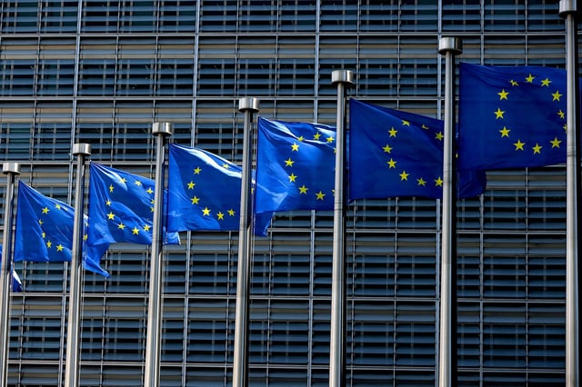 European Union flags fly outside the European Commission building in Brussels in June 2022.