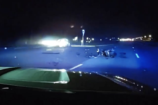 Police dashcam footage shows wreckage from a motorcycle crash along the highway in Charlotte County, Fla., on Feb. 8, 2024. 