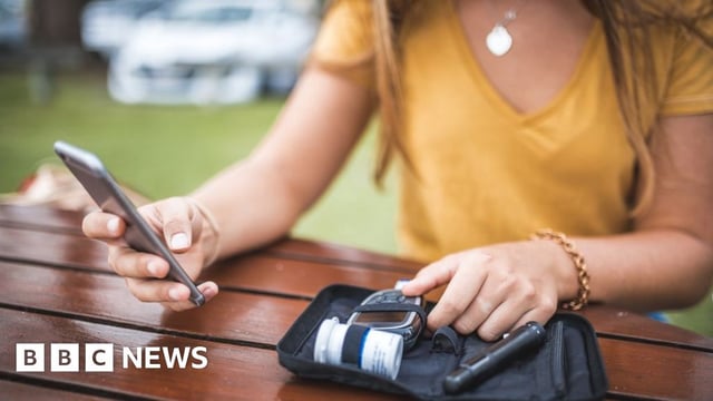 woman testing her blood sugar
