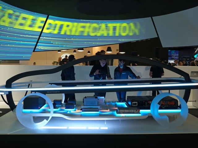 FRANKFURT AM MAIN, GERMANY - SEPTEMBER 11: Visitors look at an electric car components display at the Hella stand during the press days at the 2019 IAA Frankfurt Auto Show on September 11, 2019 in Frankfurt am Main, Germany. The IAA will be open to the public from September 12 through 22. (Photo by Sean Gallup/Getty Images)