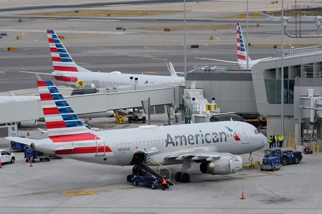 American Airlines planes sit on the tarmac at Terminal B at LaGuardia Airport, Jan. 11, 2023, in New York.
