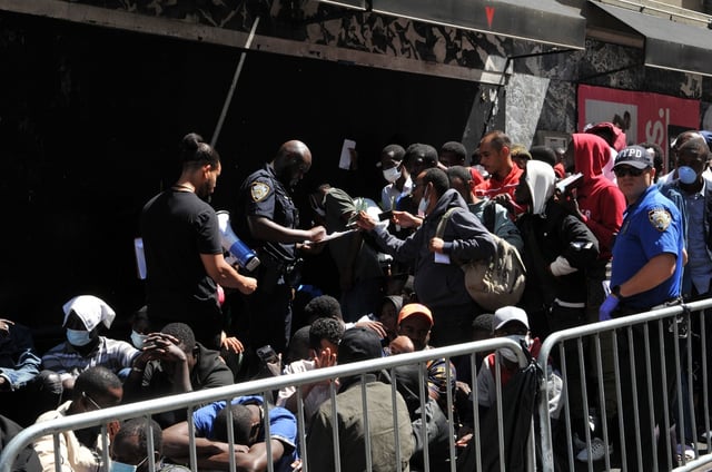 Illegal immigrants outside of Roosevelt hotel in New York City, August 2023 (Arnett Murry/Shutterstock)