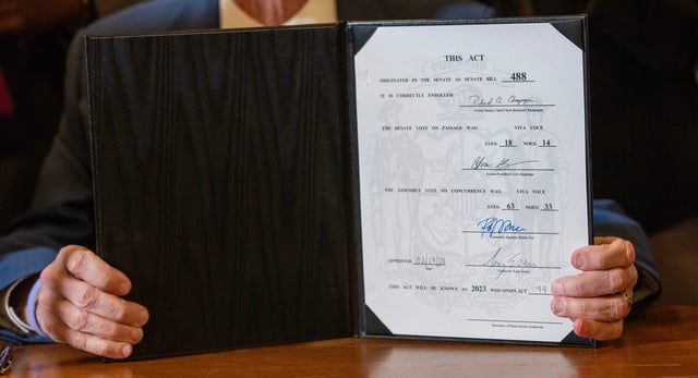 Democratic Gov. Tony Evers signs new legislative maps into law Feb. 19, 2024, at the Capitol in Madison. The maps, drawn by the governor's office and approved by the Republican-led Legislature, create new boundaries in races for state Assembly and state Senate that could end a 13-year era of lopsided Republican majorities.