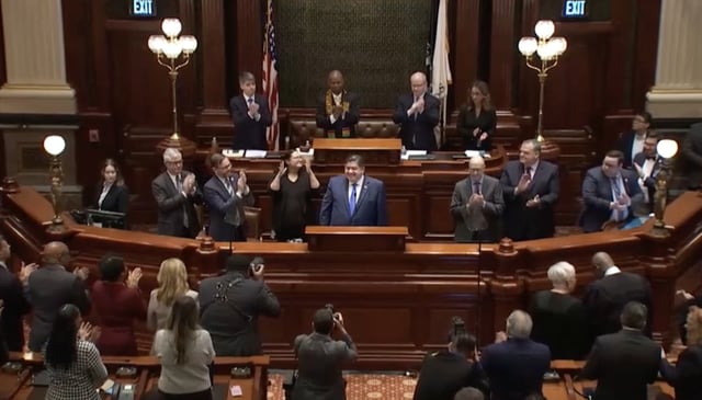 Lawmakers applaud Gov. J.B. Pritzker before his budget address Wednesday at the Illinois State Capitol in Springfield.