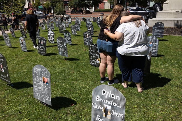 BINGHAMTON, NEW YORK - AUGUST 19: Friends and family members of people who have died from overdoses in Broome County gather for an annual memorial, August 19, 2023, in downtown Binghamton, New York. 277 names were represented with replica tombstones downtown to bring awareness to the struggles of addiction and the dangers of fentanyl and other powerful opioids. (Photo by Andrew Lichtenstein/Corbis via Getty Images)