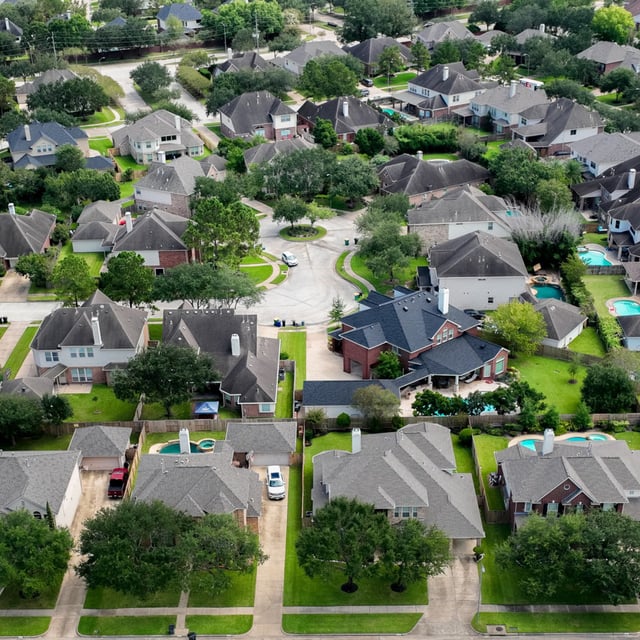 In an aerial view, homes are seen in a residential neighborhood on September 15, 2022 in Pearland, Texas. Mortgage rates climbed to close to 7 percent as of February 22, 2024, Freddie Mac said.