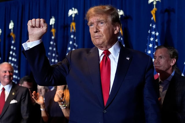 Former President Donald Trump reacts at a primary election night party at the South Carolina State Fairgrounds in Columbia on Saturday.