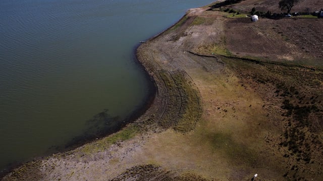 The exposed banks of the Villa Victoria Dam, part of the Cutzamala System, in Villa Victoria, Mexico on January 26, 2024.