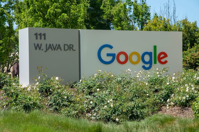 Google sign behind bushes