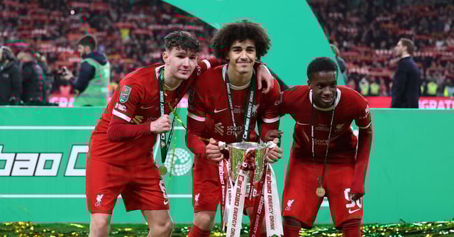 Soccer Football - Carabao Cup - Final - Chelsea v Liverpool - Wembley Stadium, London, Britain - February 25, 2024 Liverpool's Lewis Koumas, Jayden Danns and Trey Nyoni celebrate winning the Carabao Cup with the trophy REUTERS/Hannah Mckay/ File Photo