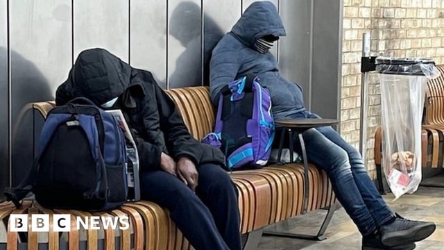 Two rough sleepers at Paddington station