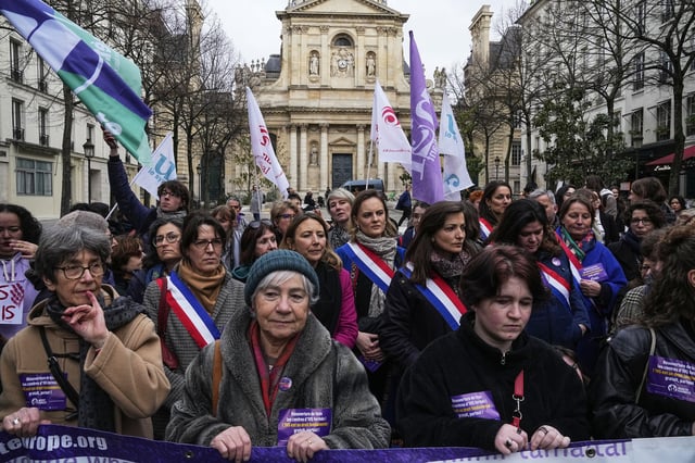 Pro-abortion rights activists attend a rally in Paris on Feb. 28, 2024. 