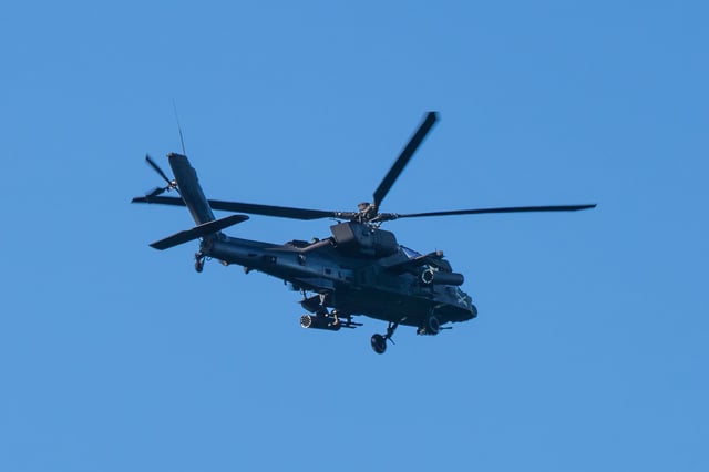 General view of an Apache helicopter flying over the Los Angeles South Bay area on February 11, 2024 in Los Angeles, California.