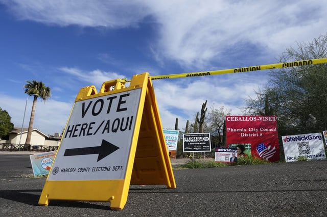 FILE - A voting sign points voters in the right direction to drop off ballots in Phoenix, Monday, Nov. 7, 2022. No Labels, which has pledged to create a pathway for an alternative candidate to run against the Republican and Democratic presidential nominees in 2024, will get a spot on the ballot in Arizona. The presidential battleground state joins Colorado in recognizing No Labels as a political party. (AP Photo/Ross D. Franklin, File)