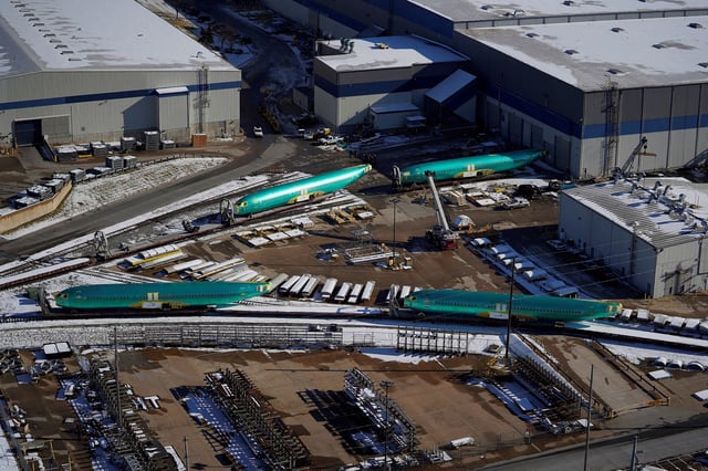 Airplane fuselages bound for Boeing's 737 Max production facility await shipment on rail sidings at their top supplier, Spirit AeroSystems Holdings, in Wichita, Kansas, U.S. December 17, 2019.
