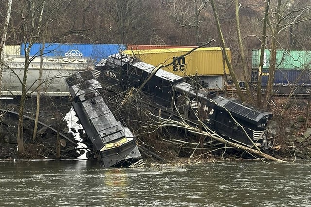 This photo provided by Nancy Run Fire Company shows a train derailment along a riverbank in Saucon Township, Pa., on Saturday, March 2, 2024.   Authorities said it was unclear how many cars were involved but no injuries or hazardous materials were reported.