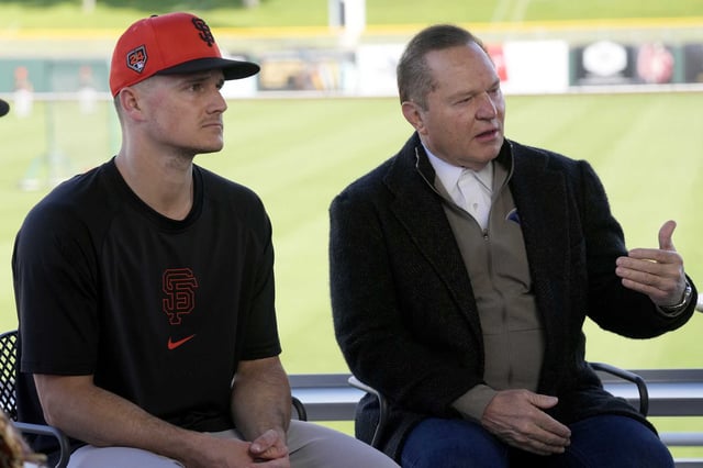 Scott Boras, right, agent of new Giants infielder Matt Chapman, left, answers a question at a news conference announcing the third baseman’s signing Monday in Scottsdale, Ariz. 