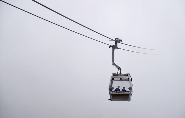 A cable car at Ngong Ping, Lantau Island, heads into the mist caused by humid weather conditions. Photo: Elson LI