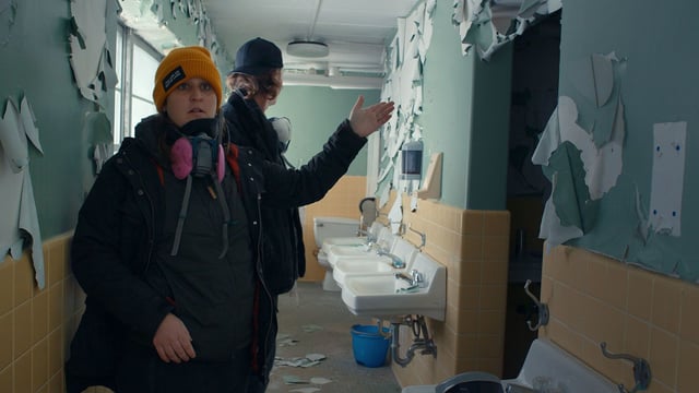 Director Katherine Kubler (left) in "The Program: Cons, Cults and Kidnapping" on Netflix.