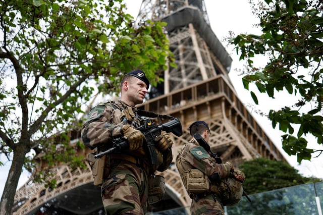 French soldiers patrol near the Eiffel Tower as part of the "Sentinelle" security plan in Paris, France, May 23, 2023. REUTERS/Benoit Tessier     TPX IMAGES OF THE DAY     