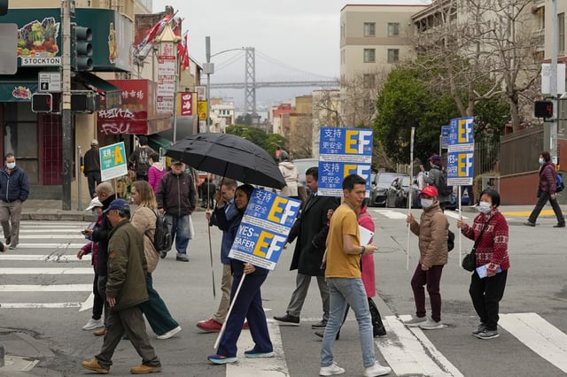 San Francisco Mayor London Breed, center left, walks in the city's Chinatown district to encourage people to vote in the primary election Tuesday, March 5, 2024, in San Francisco. Breed also encouraged people to support Props C, E, and F.