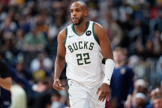 Milwaukee Bucks forward Khris Middleton (22) in the second half of an NBA basketball game Monday, Jan. 29, 2024, in Denver. (AP Photo/David Zalubowski)