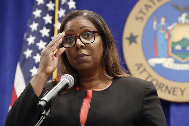In this Aug. 6, 2020, file photo, New York State Attorney General Letitia James adjusts her glasses as she announces that the state is suing the National Rifle Association during a press conference, in New York.