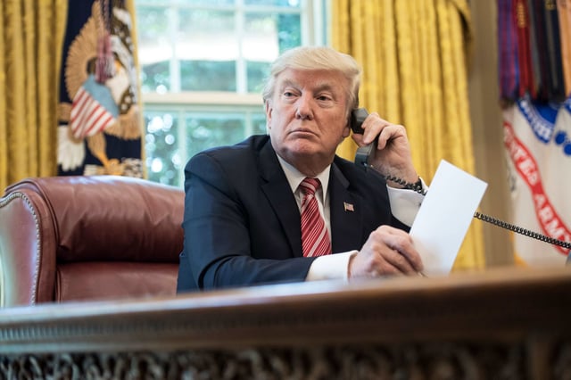 Then-President Donald Trump waits to speak on the phone in the Oval Office at the White House, on June 27, 2017.