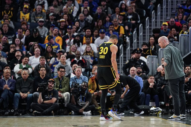 Stephen Curry of the Golden State Warriors limps off the court in the fourth quarter against the Chicago Bulls at Chase Center on March 7, 2024, in San Francisco.